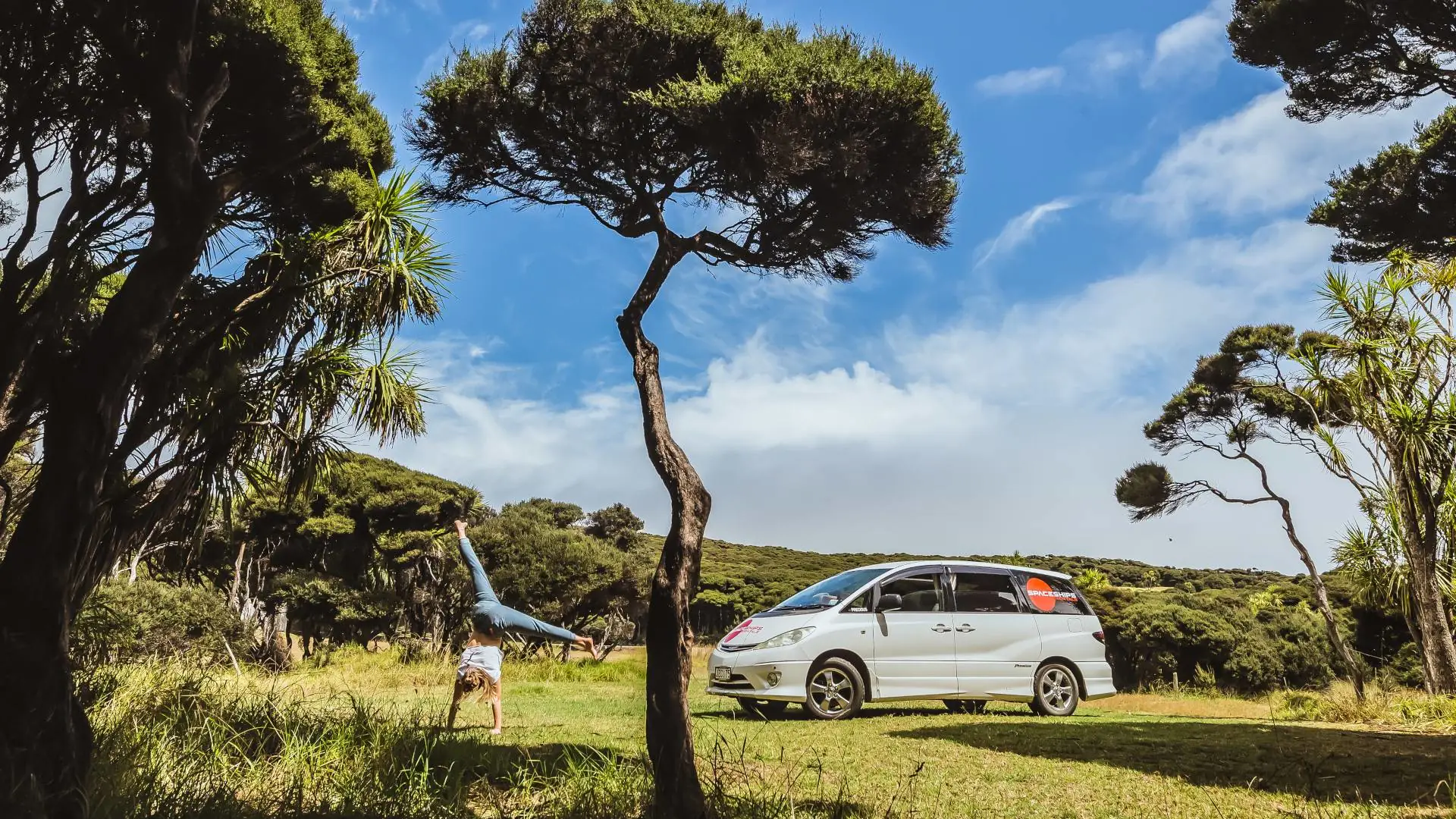 Space Traveller doing cartwheels at campsite in New Zealand